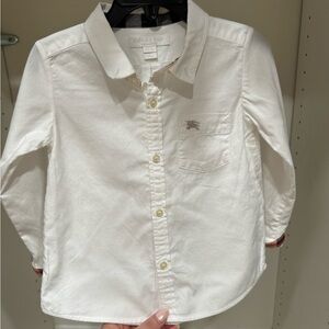 Burberry button shirt. Size 2T and the color is white.